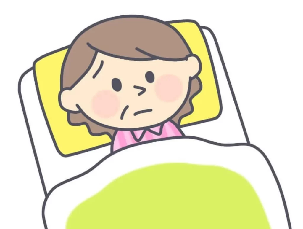 抗うつ剤の副作用で不眠症になり、布団の中で目を丸くして困っているお母さんのイラスト