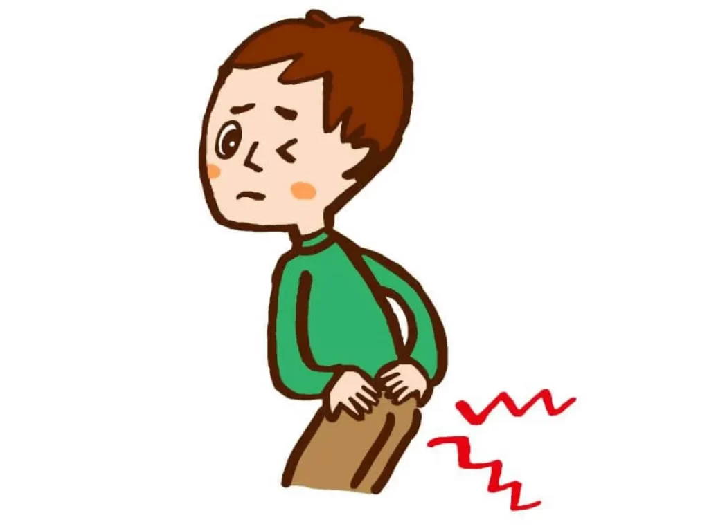腰とお尻の痛みで振り向きながら苦しそうな表情をする緑の服の男性のイラスト