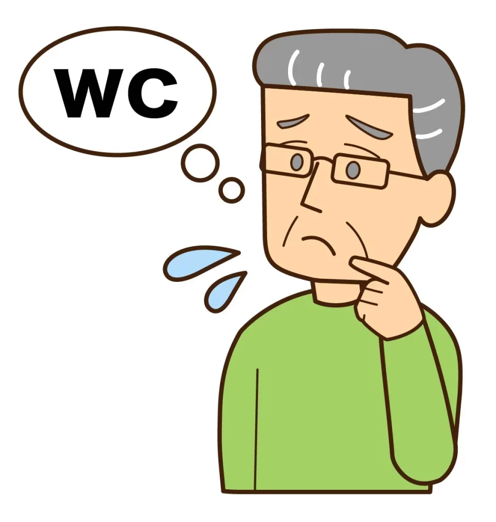 トイレマークの前で困り顔の中年男性｜尿の切れが悪い・頻尿の悩みイメージ