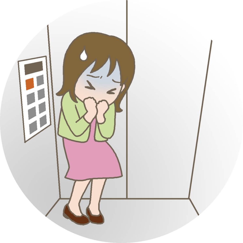エレベーター内で目を閉じ両手で顔を覆うピンクのスカートと緑の上着のOL女性、閉所恐怖症で恐怖を感じている漫画風イラスト